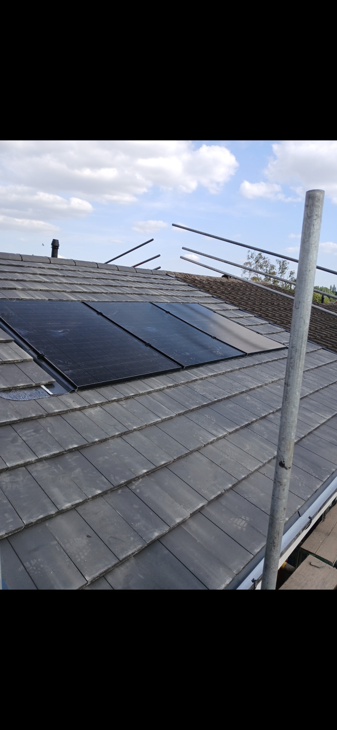 Solar panels on slate roof by All About Roofing Birmingham