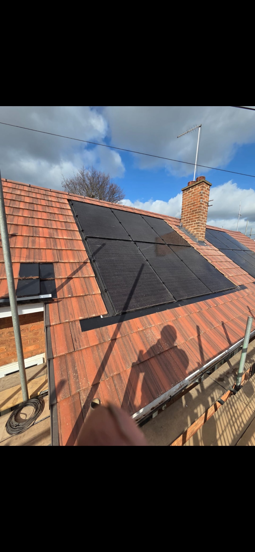Solar panels installed on red tiled roof Birmingham